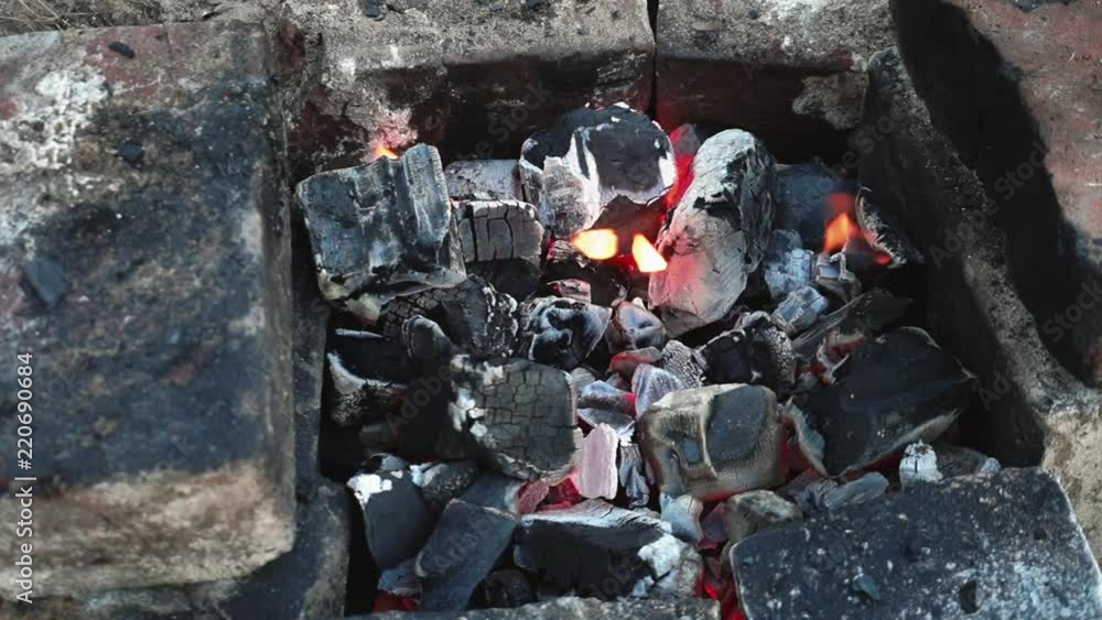 Charcoal for barbecue. Barbecue. Outdoors. Bricks. Close-up. Charcoal for barbecue. Barbecue. Outdoors. Bricks. Close-up.