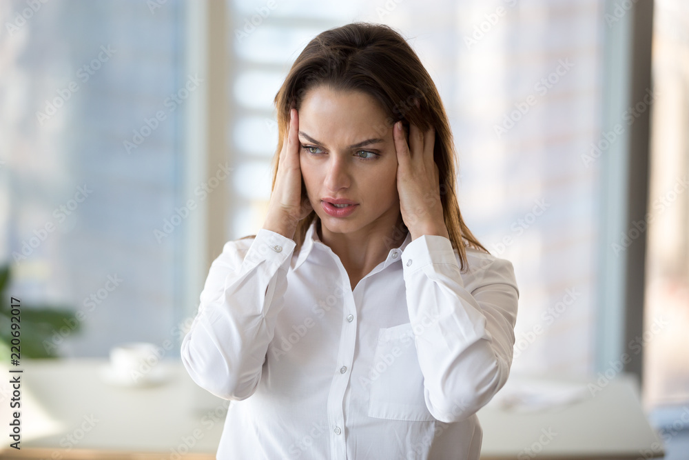 Stressed tired businesswoman in panic feeling fatigued frustrated, exhausted female employee or office worker suffering from overwork, headache, hormone imbalance, having migraine at work concept Stressed tired businesswoman in panic feeling fatigued frustrated, exhausted female employee or office worker suffering from overwork, headache, hormone imbalance, having migraine at work concept