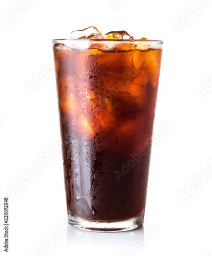 Glass of ice black tea isolated on white