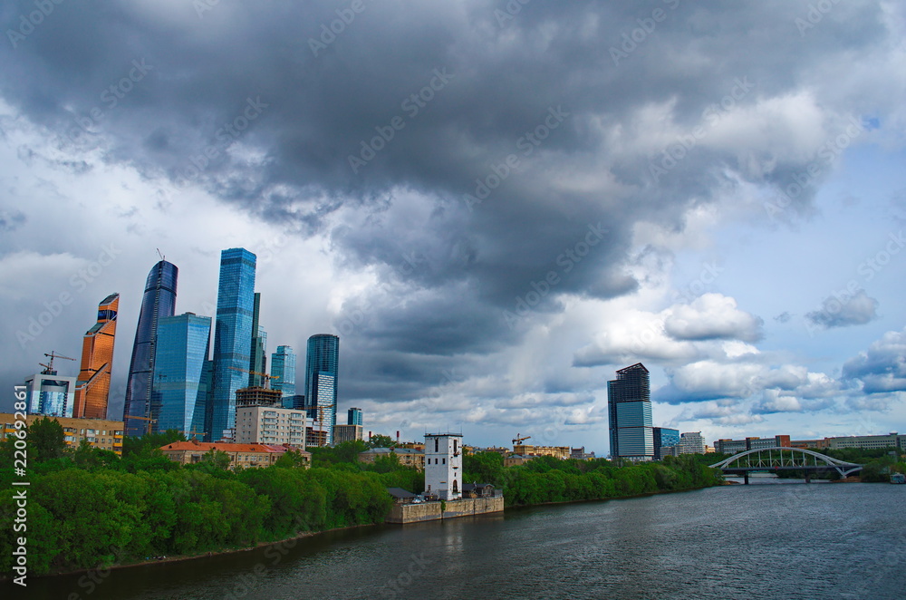 Rainy sky over skyscrapers Moscow City and Moscow river
