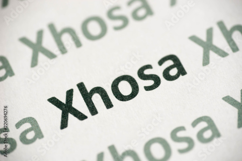 word Xhosa language printed on paper macro photo