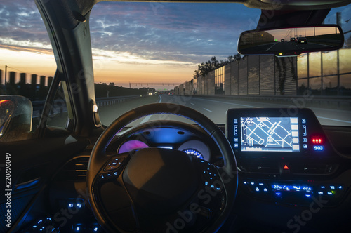 concept of the cockpit of an autonomous car driving the night photo