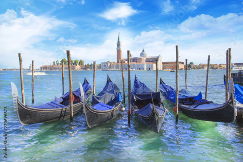 Beautiful view of the gondolas and the Cathedral of San Giorgio Maggiore, on an island in the Venetian lagoon, Venice, Italy © marinadatsenko