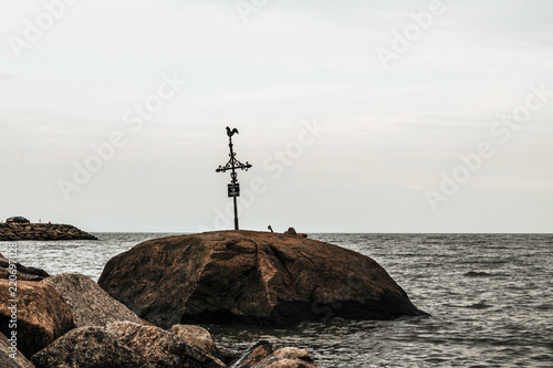 Weathervane on top of a rock in Petite-Riviere-St-Francois in Quebec, Canada, 