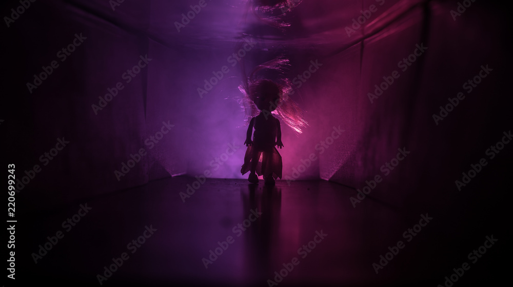 Creepy silhouette in the dark abandoned building. Horror about maniac concept or Dark corridor with cabinet doors and lights with silhouette of spooky horror person Creepy silhouette in the dark abandoned building. Horror about maniac concept or Dark corridor with cabinet doors and lights with silhouette of spooky horror person