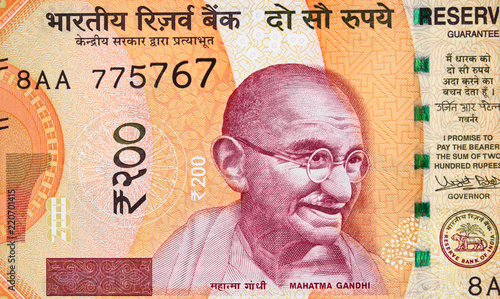 Mahatma Gandhi face on India 200 rupee (2017) banknote close up, Indian money closeup.