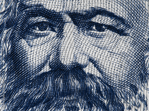 Karl Marx portrait on East German 100 mark (1975) banknote closeup macro, famous philosopher, economist, political theorist, sociologist and revolutionary socialist..