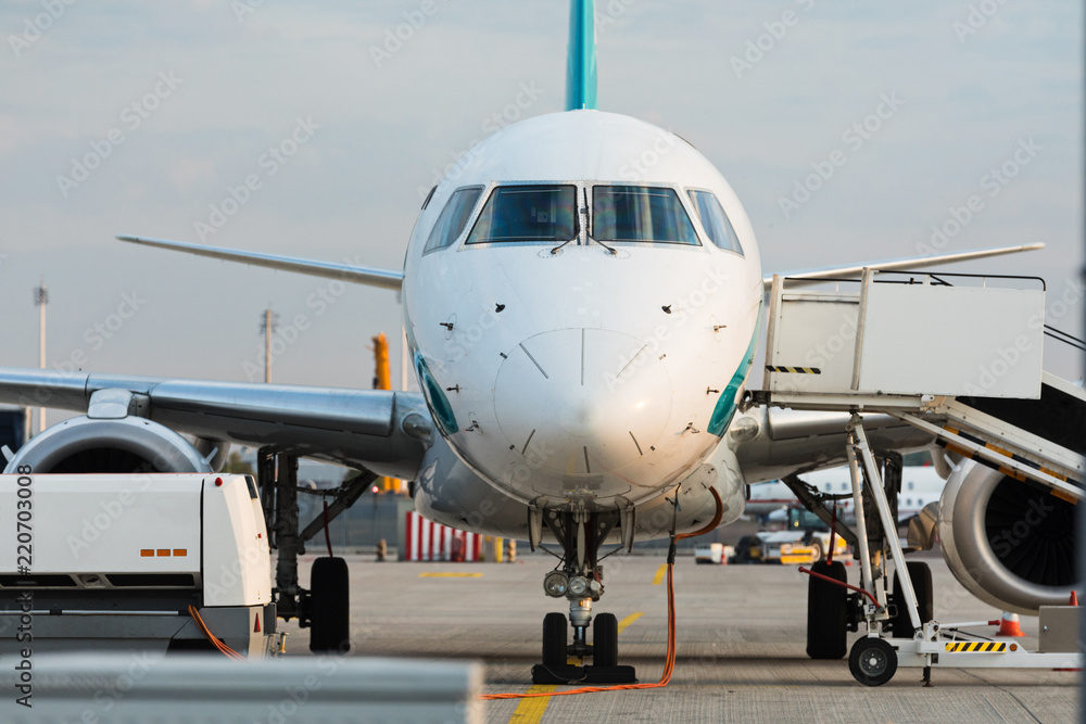 Front view of commercial jet plane on the runway. Front view of commercial jet plane on the runway.
