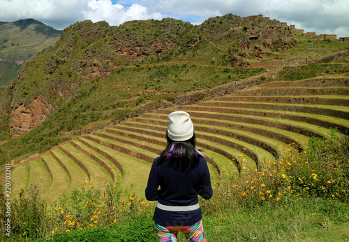 Canvastavla One female tourist admiring the Inca ancient agricultural terraces at Pisac Arch