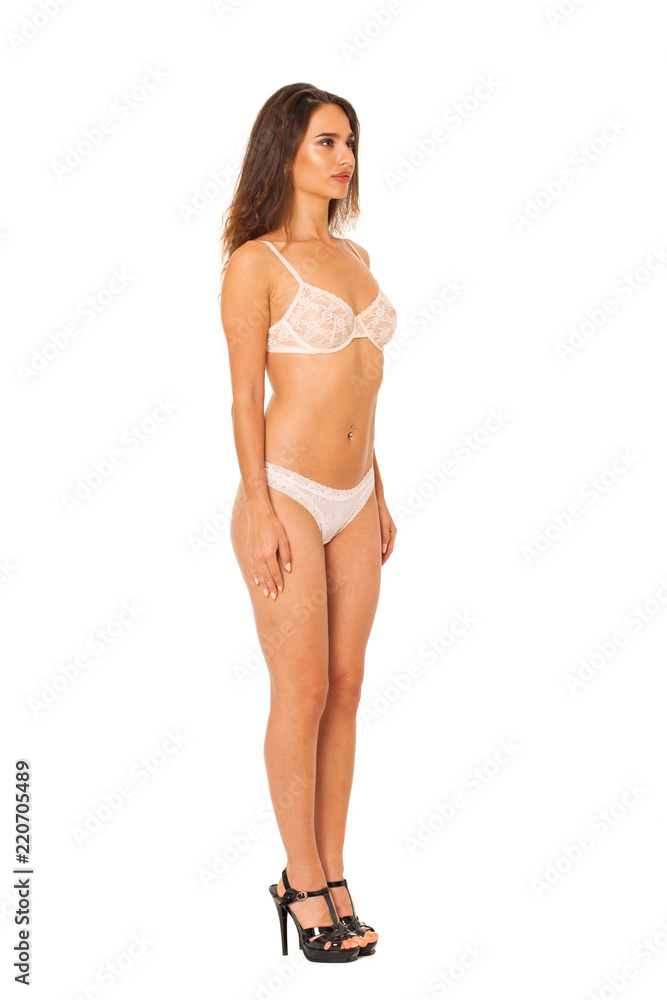 Full length beautiful slim tanned woman in bikini, isolated on white background Full length beautiful slim tanned woman in bikini, isolated on white background