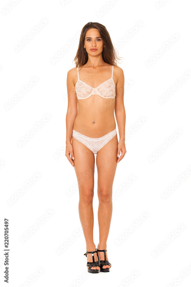 Full length beautiful slim tanned woman in bikini, isolated on white background Full length beautiful slim tanned woman in bikini, isolated on white background