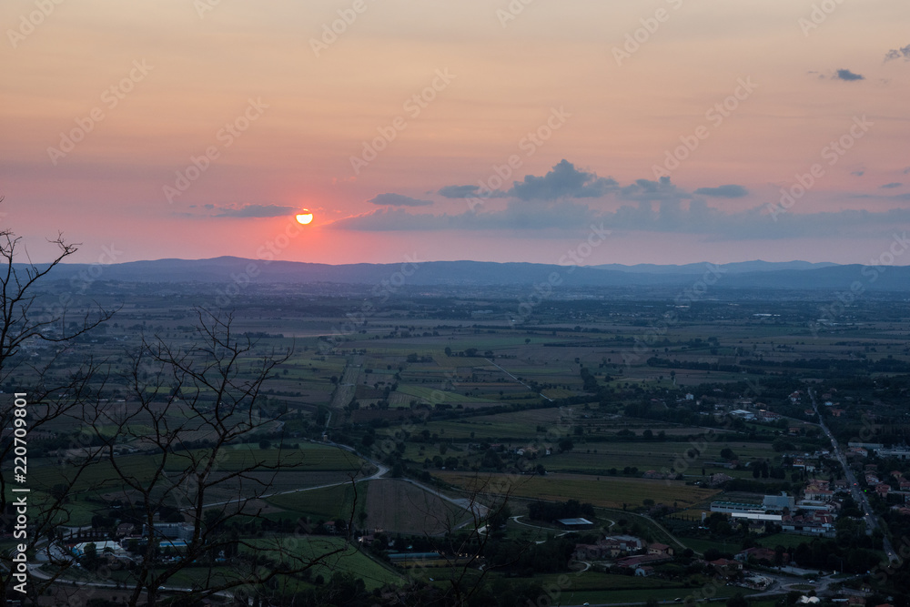 Sunset over the Umbrian landscape from the hills of Cortona, Italy