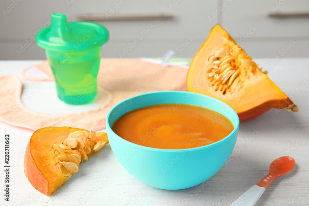 Bowl of healthy baby food on light table Bowl of healthy baby food on light table