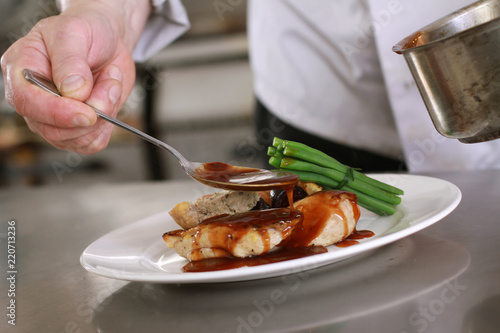 chef plating chicken dinner