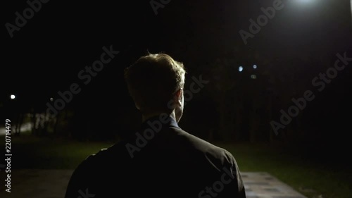 The male walking outdoor. evening night time, slow motion photo