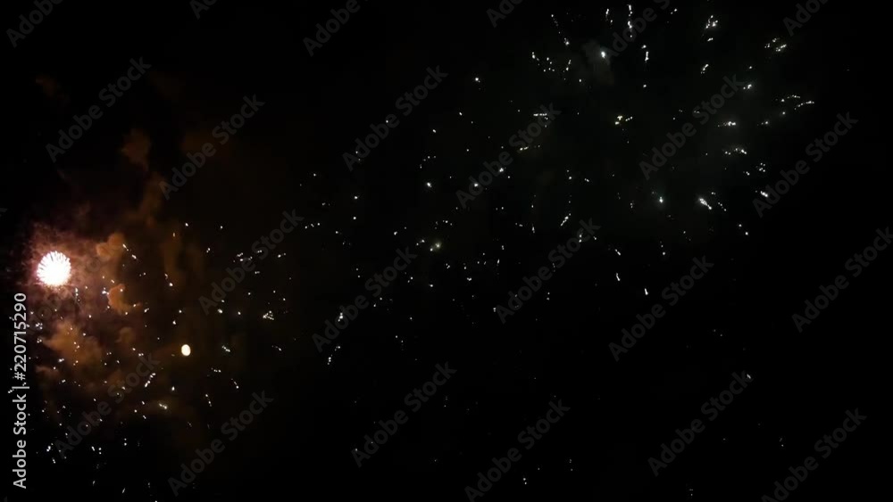 Beautiful fireworks in the night sky with the moon Beautiful fireworks in the night sky with the moon
