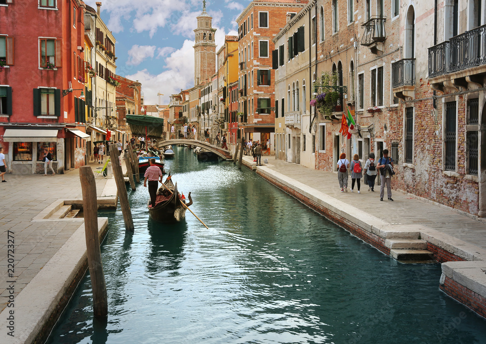 Charming canal street with Gondola in Venice, Italy