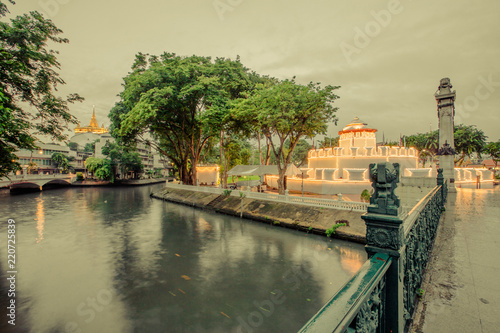 Night view and rain shower in Mahakarn fort, Mahachai Road, Wat Boraveiwet, Pom Prap Sattru Phai, Bangkok, Thailand photo