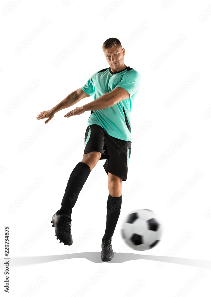 soccer player kicking the ball in the isolated on white