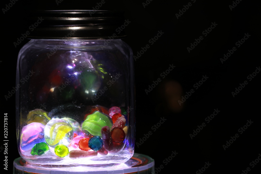 Close up transparent colorful mable and reflection on the ground Close up transparent colorful mable and reflection on the ground
