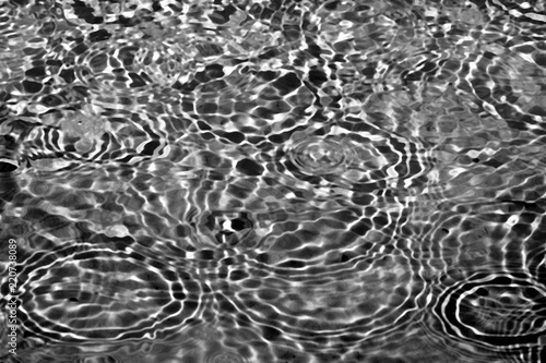 Black and white abstract pattern based on the surface of the water in the fountain_