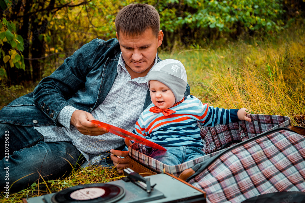 baby with dad in the Park in autumn baby with dad in the Park in autumn
