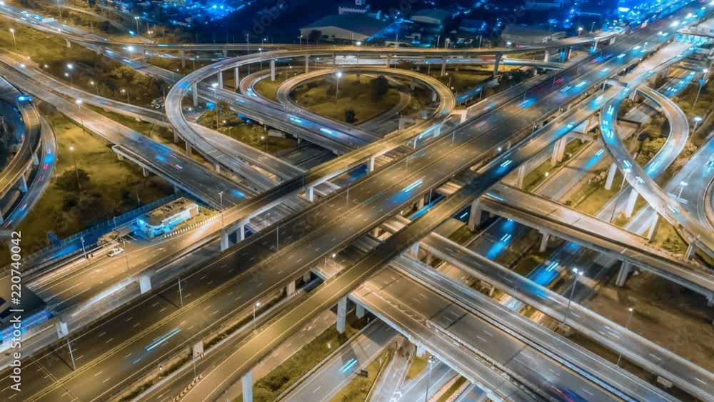 timelapse of night city traffic on 4-way stop street intersection circle roundabout in bangkok, thailand. 4K UHD horizontal aerial view. timelapse of night city traffic on 4-way stop street intersection circle roundabout in bangkok, thailand. 4K UHD horizontal aerial view.