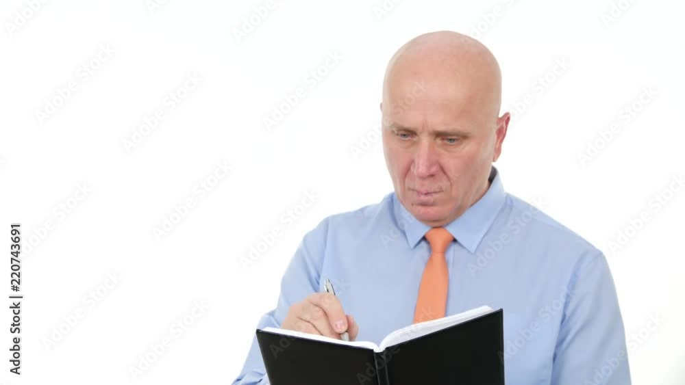 Businessman Image Reading and Writing in Agenda Businessman Image Reading and Writing in Agenda