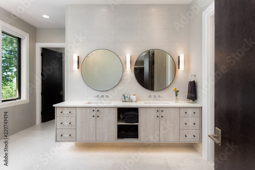 Fototapeta Elegant bathroom in new luxury home with two sinks and two mirrors