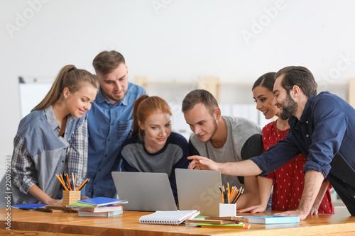 Students doing homework tog...