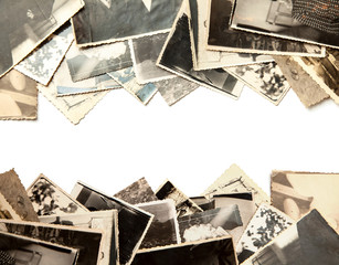 Stack old photos isolated on white background. Postcard rumpled and dirty vintage