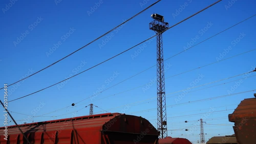 Cargo carriage of the railway train.	Shooting in the movement.