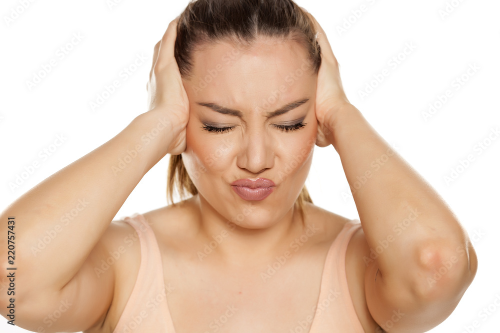 Portrait of beautiful woman with strong headache on white background Portrait of beautiful woman with strong headache on white background