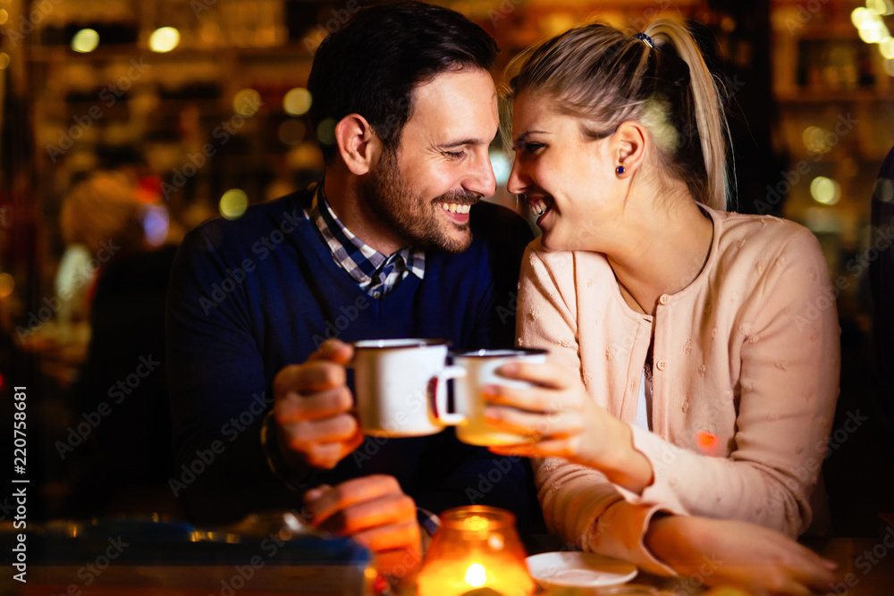 Romantic couple dating in pub at night