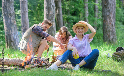 Healthy snack. Woman straw hat sit meadow hold apple fruit. Healthy life is her choice. Girl enjoy picnic with healthy snack apple fruit nature background. Girl with friends at picnic in forest