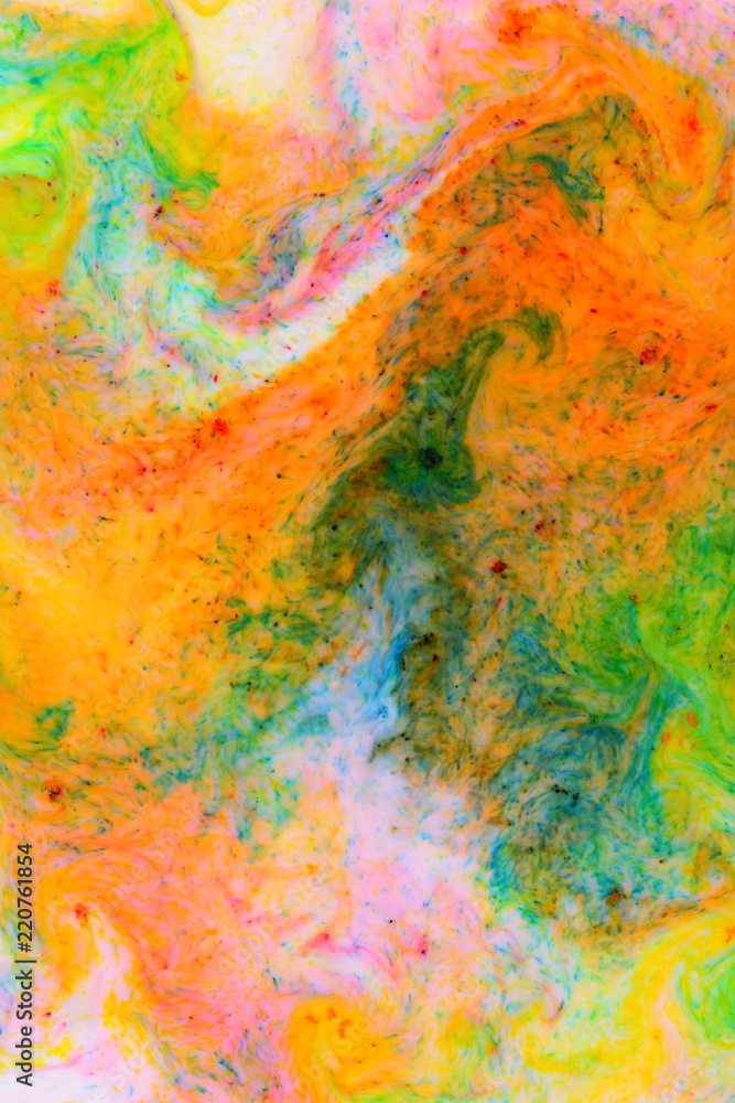 Fluid art. Abstract colorful background. Multicolored stains on liquid. Multicolored pattern with paints on liquid. Blurred background