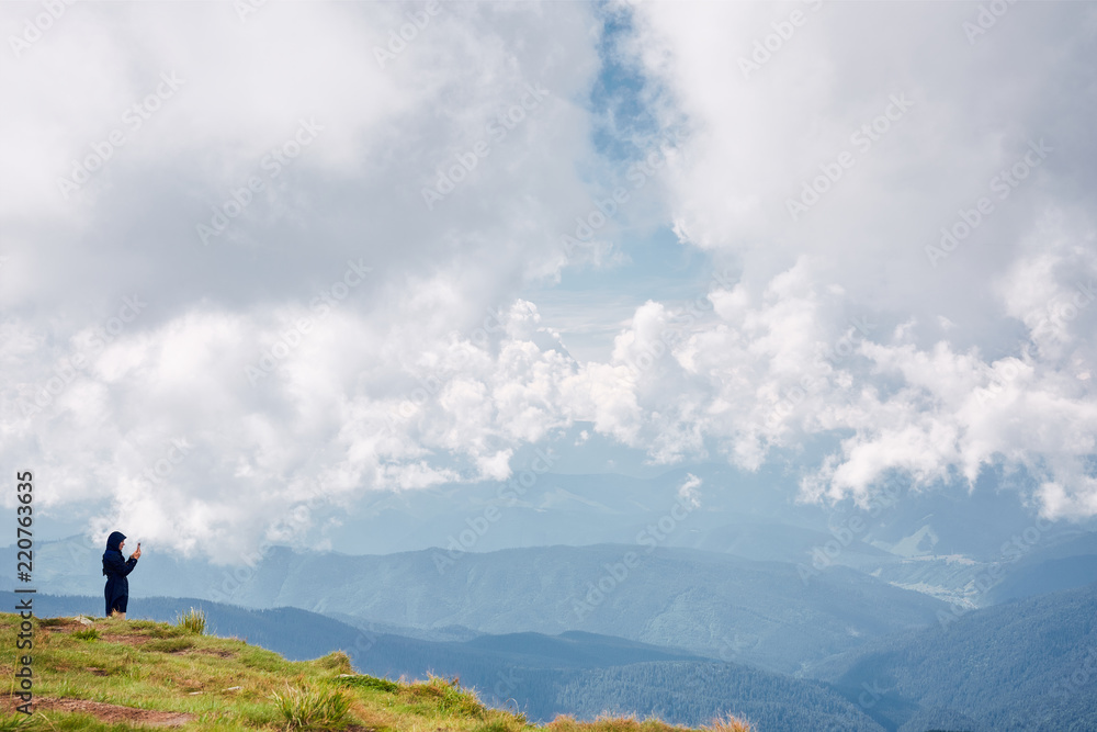 hiker enjoying the view of mountains landscape. Carpathians, Ukraine hiker enjoying the view of mountains landscape. Carpathians, Ukraine