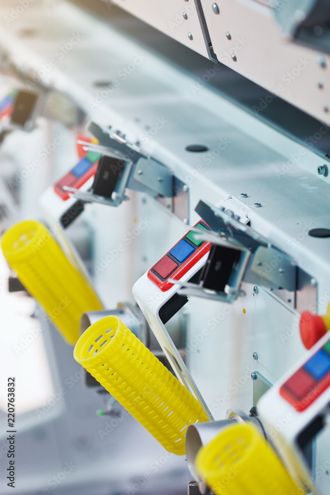 Textile factory. Factory on manufacture of threads. Rows of automated machines for yarn manufacturing. Modern Textile Plant. Textile factory. Factory on manufacture of threads. Rows of automated machines for yarn manufacturing. Modern Textile Plant.