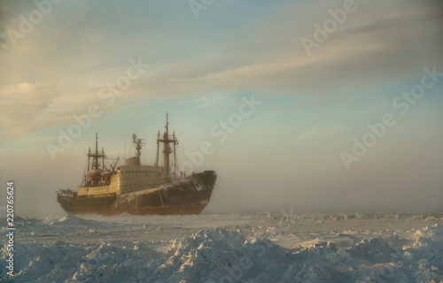 The icebreaker stands in the ice of the Arctic Ocean, a snowstorm begins.. © Евгений Плотников