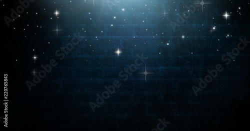 Stars glowing over Vignette and light on blue brick wall