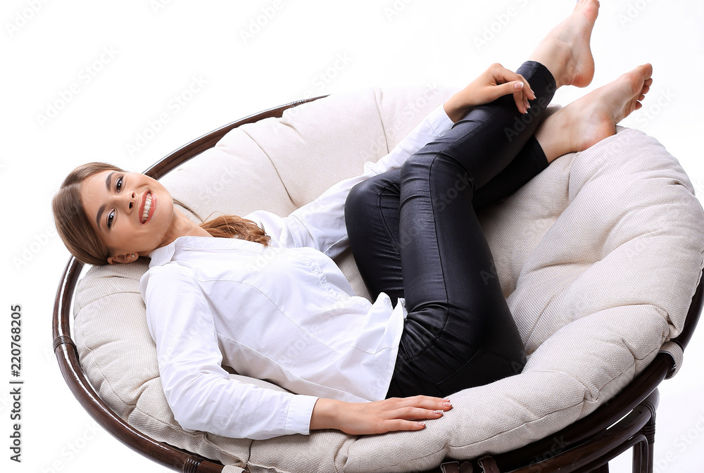 young business woman resting in a big soft chair