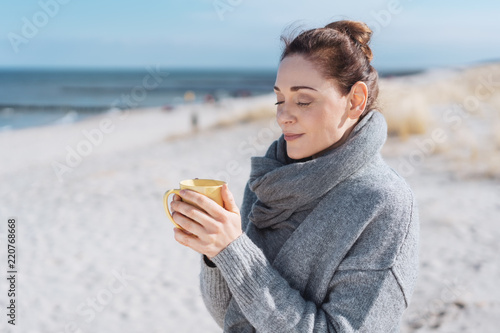 Young woman enjoying a relaxing cup of coffee