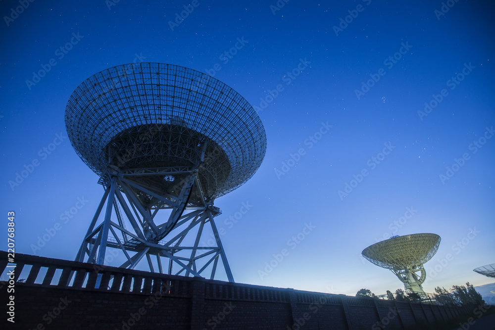 The silhouette of a radio telescope The silhouette of a radio telescope