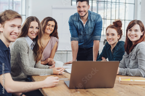 Motivated business team with their team leader photo
