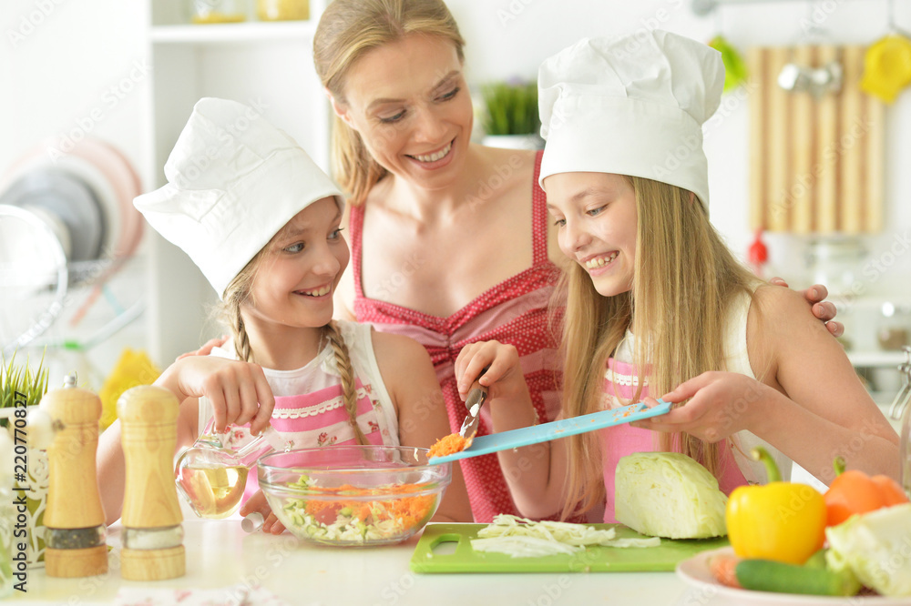 Portrait of a mom and daughter cook Portrait of a mom and daughter cook