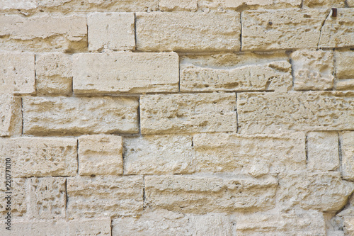 Damaged sandstone wall
