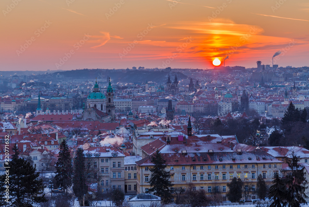 Winter morning in Prague, Czech Republic. Prague roofs covered snow during sunrise.