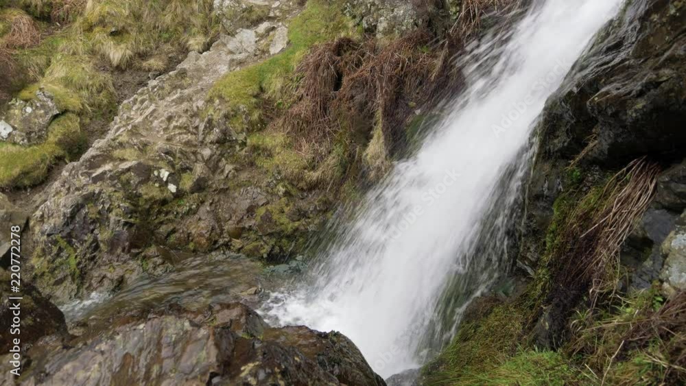 Water crashing down over rocks at Lightspout waterfall by Carding Mill Valley in the Shropshire hills Area of Outstanding Natural Beauty, England Water crashing down over rocks at Lightspout waterfall by Carding Mill Valley in the Shropshire hills Area of Outstanding Natural Beauty, England