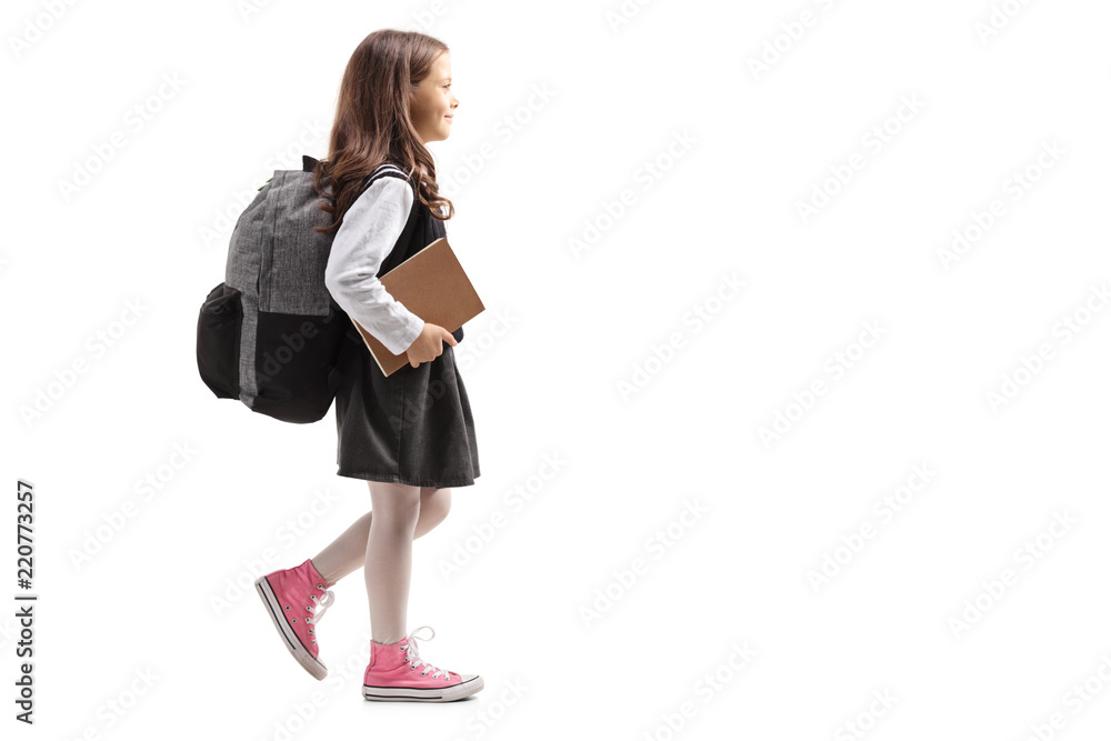 Schoolgirl with a backpack walking Schoolgirl with a backpack walking