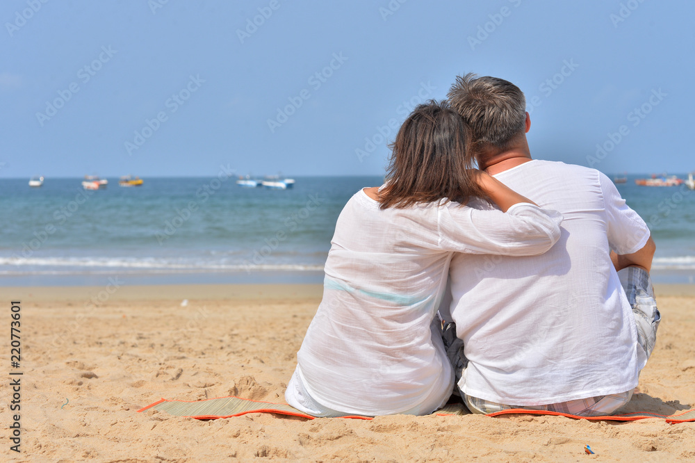Portrait of a couple hugging on seashore